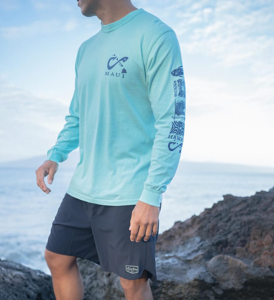 man in long sleeve shirt by the coastline