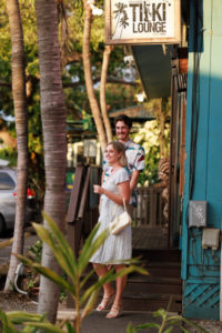 a young couple walking out of a restaurant staircase