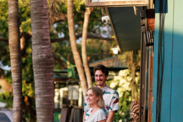 a young couple walking out of a restaurant staircase