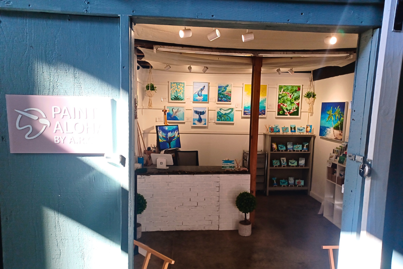 storefront with paintings inside