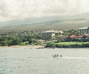 boat motors outside of beach resort area in hawaii