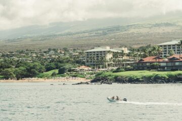 boat motors outside of beach resort area in hawaii