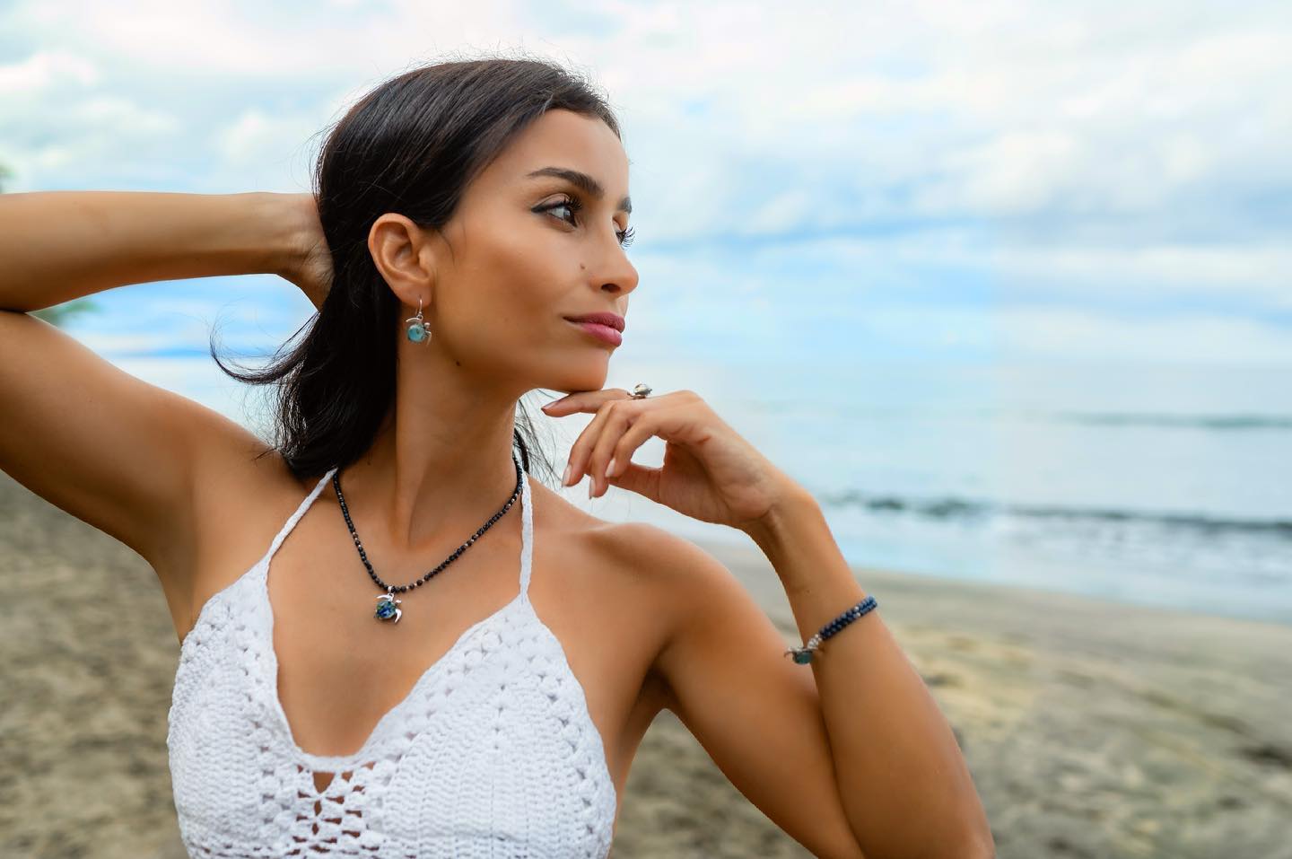 woman with sea turtle jewelry