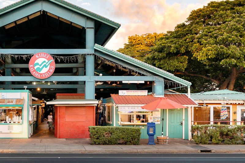 shopping center storefront next to roadway